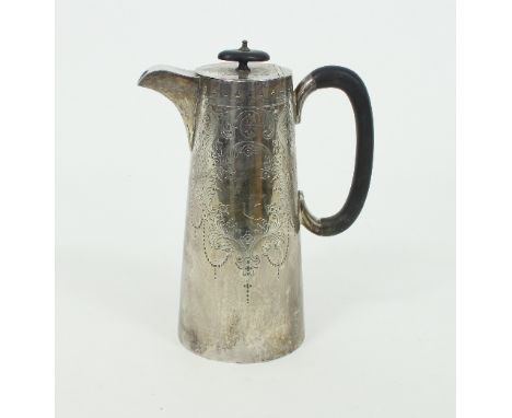 A silver water jug, Sheffield 1902, fitted an ebonised C scroll handle and with engraved decoration, 23cm high, approximately