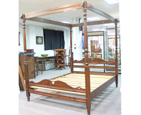 A four-poster bed with turned columns and slatted base, with four acorn finials for use when bed is used as a double, 154cm w