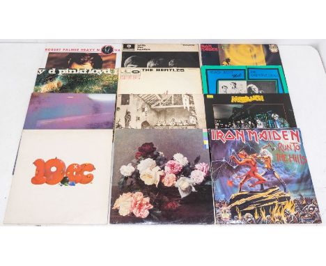 A large collection of vinyl LP Records in 8 boxes -  including rock, pop from the 60s to 80s including some country and compi