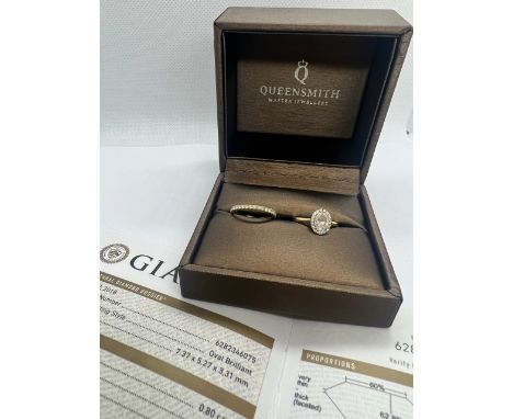 An 18ct yellow gold and platinum oval brilliant cut diamond ring. Colour D, 0.80 carat and VS2. Size K. GIA Diamond Dossier r