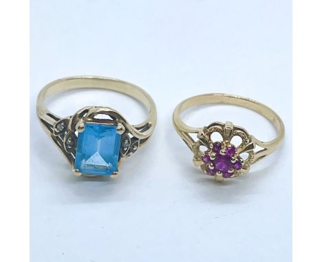 Two gem set dress rings. One a small ruby cluster ring in a yellow mount bearing rubbed markings to the outside of the shank,