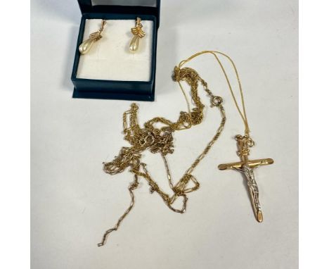 A collection of 9ct and yellow metal jewellery comprising a 9ct crucifix (approximate weight 1.3 grams) a pair of yellow meta