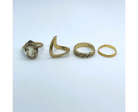 A collection of four ladies rings. Comprising a smoky quartz cocktail ring, stamped "9ct" to the shank, size O, gross weight 