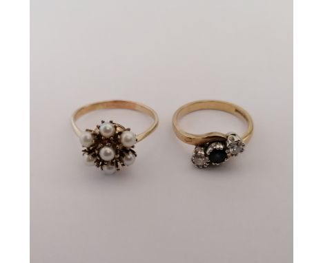 Two dress rings. Comprising a sapphire and diamond trilogy ring, in 9ct yellow gold, marked for Birmingham, size O, approxima