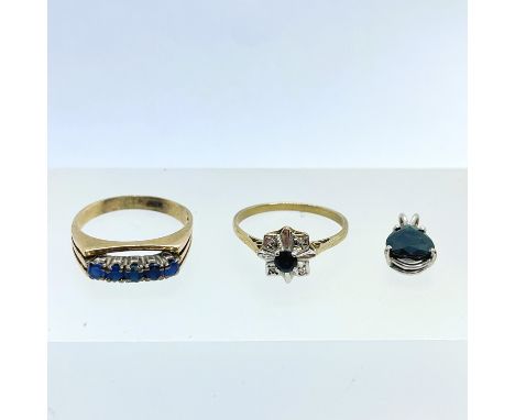 A sapphire and diamond set yellow metal dress ring, along with a blue stone set yellow metal dress ring and a white metal sap