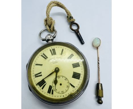 A Sterling silver key wound pocket watch and an opal cabochon set stick pin. White enamel dial with roman numerals and second