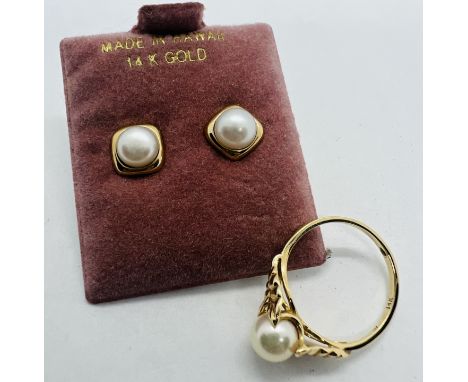 A cultured pearl foliate design ring, along with a matching pair of cultured pearl studs. All in yellow metal stamped "14K". 