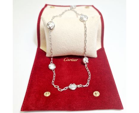 A Pasha De Cartier white gold and mother of pearl station necklace, with a Cartier pouch and pad. Circa 2009, the belcher lin