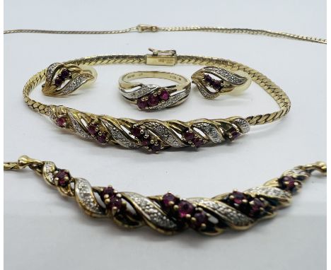 A suite of diamond and ruby jewellery in 9ct yellow gold. Comprising hoop earrings, necklace, bracelet and ring. The ring is 