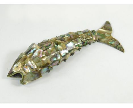 ARTICULATED FISH. A white metal, mother of pearl & abalone shell articulated fish. Length 18cm.  Please note that all items i