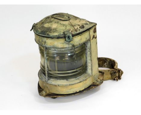 MAST HEAD LAMP. A copper mast head lamp with applied panel 'Trawling'. With mast attachment. Height 40cm.  Please note that a