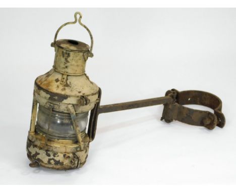 MAST HEAD LAMP. A painted metal mast head lamp with attachment. Height of lamp approx. 42cm. Length of attachment approx. 57c