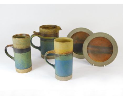ROBIN WELCH. Five pieces of Robin Welch domestic ware. The jug & one mug have a small rim chip. Impressed marks. Jug height 1