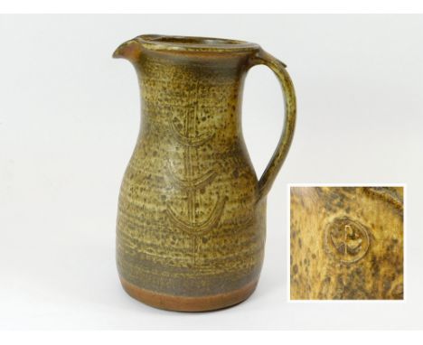 RAY FINCH. A Ray Finch, Winchcombe Pottery pitcher. Personal Winchcombe mark at base of handle. Height 25cm.  Please note tha