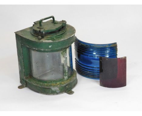 MAST HEAD LAMP. A green painted metal mast head lamp. Height 31cm. Also, two coloured glass lenses.  Please note that all ite