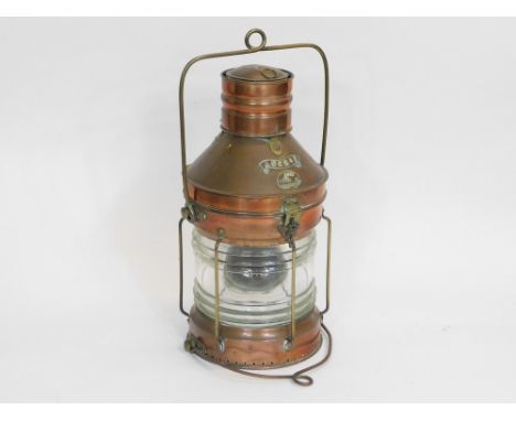 ANCHOR LAMP. A copper & brass 'anchor' lamp with plaque, numbered 4070. Height 54cm.  Please note that all items in this auct