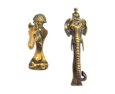 Two early 20thC brass door knockers, comprising a horses head with shell capped top, 14cm high, and an elephant with elongate