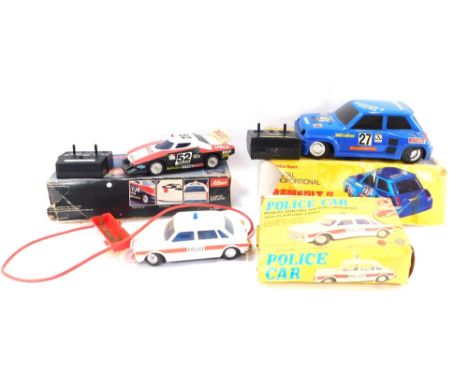 Remote controlled cars and rally cars, comprising a Schuco Radiograph Lancia Stratus 1:18 scale, with remote control, a Radio