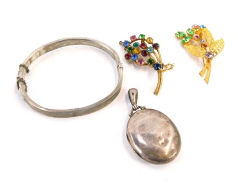 A silver bangle and locket, the plain design circular locket, 5cm high, together with a silver hinged bangle of plain design,