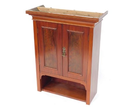 A mahogany wall hanging cupboard, with moulded cornice and two single doors with single shelf base, 93cm high, 74cm wide, 31c