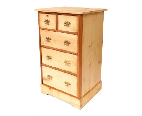A stripped pine chest of drawers, with two short and three long drawers, with brass scroll handles, on bracket feet, 110cm hi