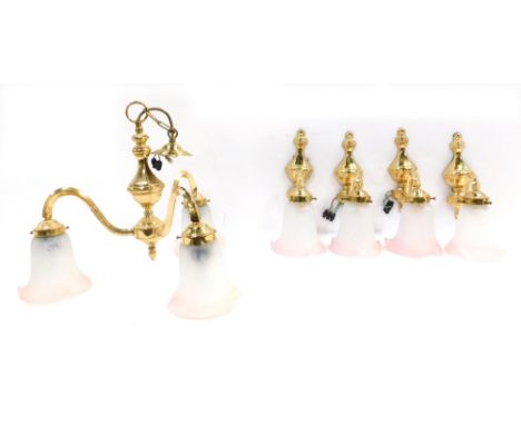 A 1989 lighting set, comprising a three branch chandelier with pink glass shades, and four matching wall lights, the central 