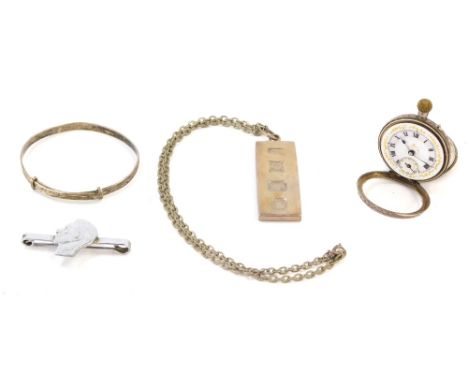 A silver one ounce ingot on chain, a silver bangle, foliate engraved, George VI tie pin, cut from a silver coin, and a lady's