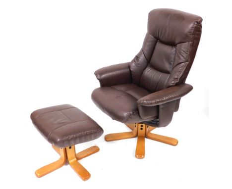 A Julian Bowen light brown leatherette armchair and matching footstool. (2)