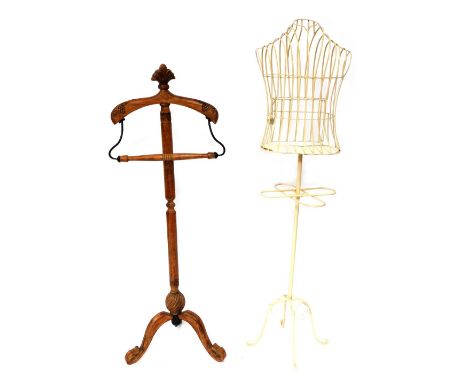 A retro carved wooden mannequin, raised on cabriole legs, 141cm high, together with a cream painted cast iron mannequin, or f