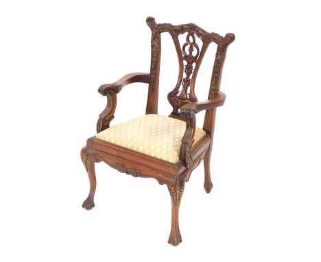 A mahogany child's chair, in the Chippendale style with cream drop-in seat, 52cm high, 33cm wide. The upholstery in this lot 