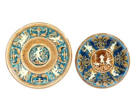 A pair of Austrian porcelain Villeroy &amp; Boch style wall plates, one with dark blue raised relief, of warriors, 30cm diame
