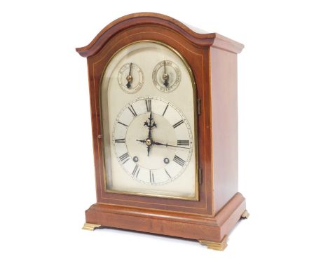 A late 19thC mahogany cased mantel clock, with arch top dial and silvered numeric chapter ring, the twenty one day movement w