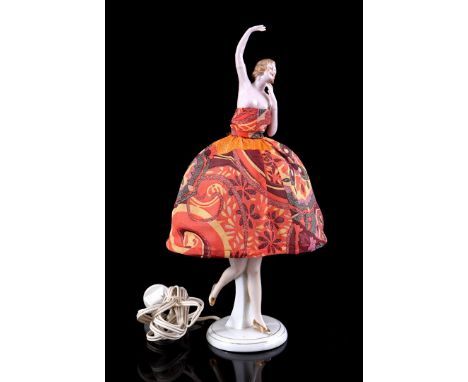 Porcelain half doll table lamp with textile dress, 38 cm high