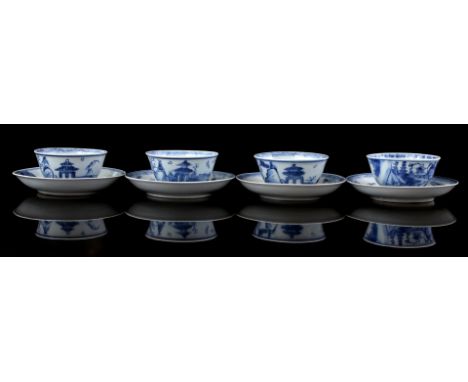 4 porcelain cups and saucers with blue and white decor of fishing boats and gazebo in a sea/mountain landscape, marked with l