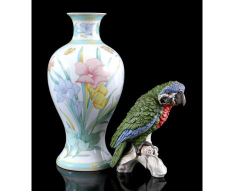 Hutschenreuther porcelain vase with floral decor and butterflies 35.5 cm high and Goebel statue of a parrot, 21 cm high