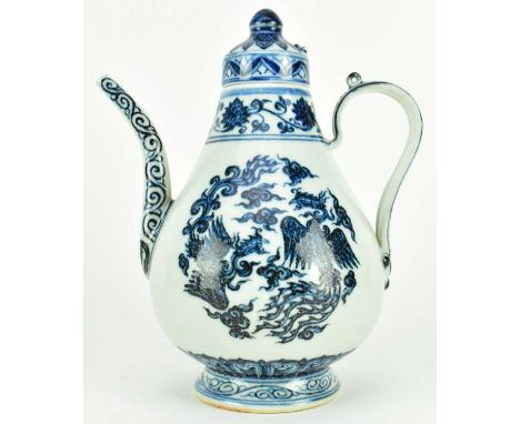 A Ming Xuande mark blue and white porcelain ewer with lid. The pear-shaped body rising from a short flared foot with cover, d