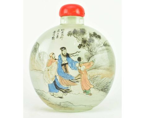 A large glass moon flask shaped snuff bottle. The ovoid shaped bottle depicting a scene of figurines amidst landscape with re