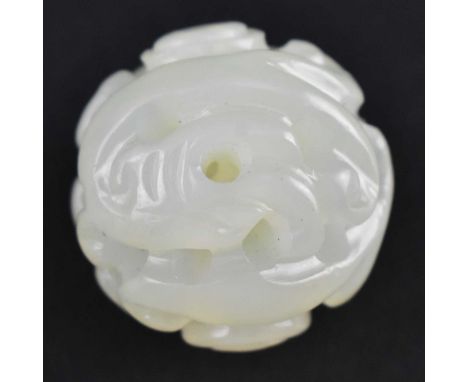 A Qing dynasty jade craved with "Double dragons". The globular shaped of jade carved with two dragons amidst clouds.Measures 