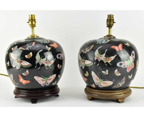Two Qing dynasty/ Early Republic Chinese famille noir ceramic ginger jar converted to a table lamps. Each ovoid shape jar hav
