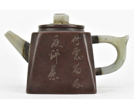 A Qing Dynasty Yang Pengnian jade and pewter inlaid Yixing zisha ceramic teapot. The teapot modelled in form of a cube-shape 