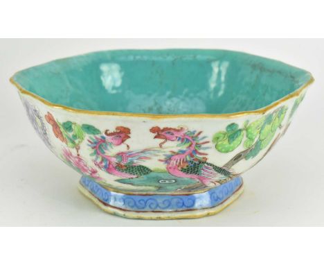A Qing dynasty Tongzhi period famille rose ceramic footed bowl. The lobed hexagonal shaped bowl with gilt rim decorated with 