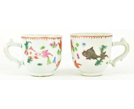 A pair of Qing dynasty ceramic cups. Each cup decorated with Carps and algae, with handle.Each measures approx. 6cm tall.