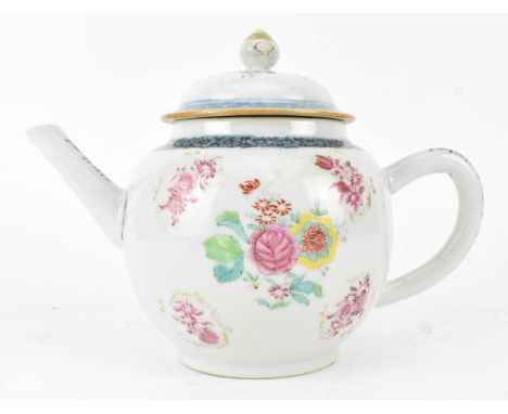 A Qing dynasty 18th century ceramic famille rose teapot with cover. The globular shaped tea pot decorated with scrolls of flo