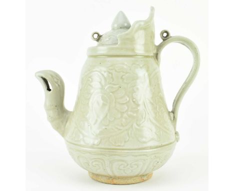 A Yuan dynasty qingbai ewer. The ewer impressed with blossoming flowers to the body with a foliate motif lid, with a phoenix 