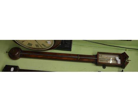 A mahogany stick barometer, circa 1820, broken arched pediment, exposed mercury tube with a single vernier silvered dial, the