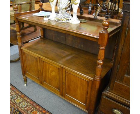 A mid Victorian mahogany two tier buffet, the rectangular top with three quarter gallery, the lower tier enclosed by three pa