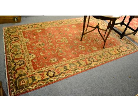 A Ziegler Mahal design carpet, North Afghanistan, the terracotta field of cloudbands and flowering vines enclosed by camel bo