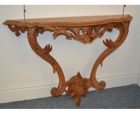 A George III pine console table with acanthus carved supports