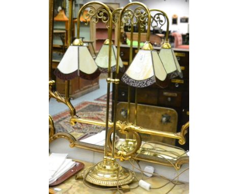 <A brass twin branch table lamp in the Tiffany style 