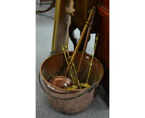 A large 19th century copper log bin with iron swing handle, 63cm diameter; two warming pans; 19th century three piece compani
